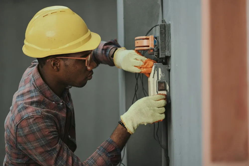 Professional technician performing precise repair on high-end appliance